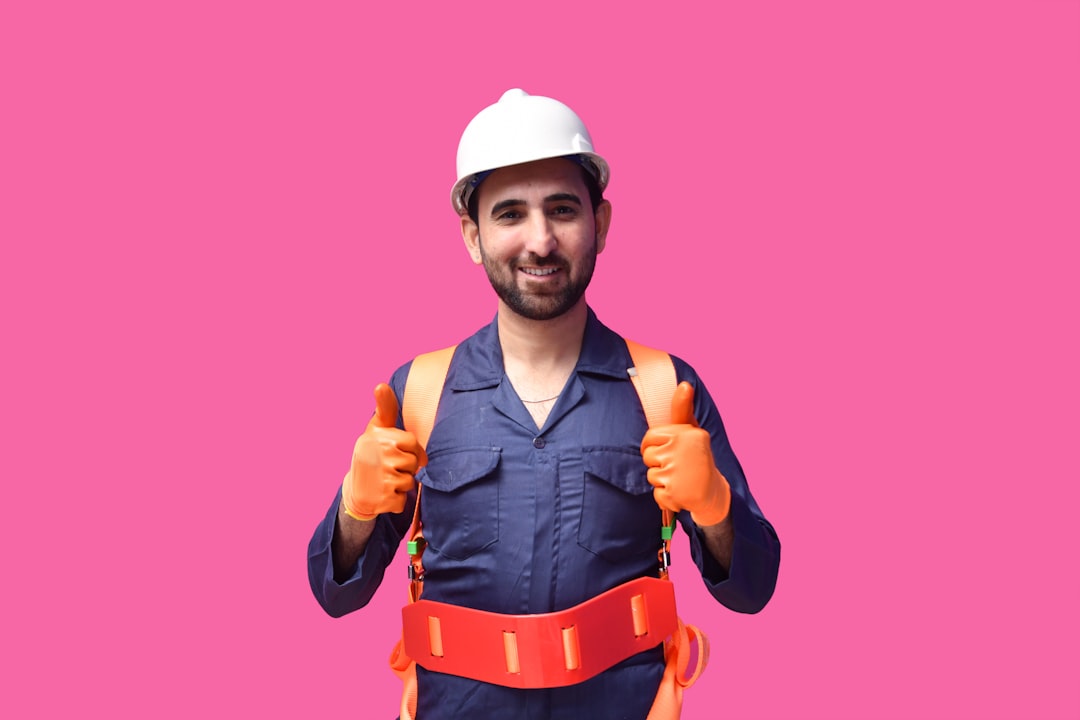 Tradesperson holding roofing tools on a job